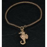 A 9ct gold seahorse pendant, an unmarked rose gold bracelet, 8.1g