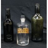 Two mid 19th century glass bottles, one applied with ?Inner Temple? seal, 24cm and 27cm high; a late