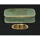 A 9ct gold Art Nouveau brooch, set with amethyst, boxed