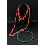 A single strand of graduated natural coral beads; another coral necklace; a composite jadeiete