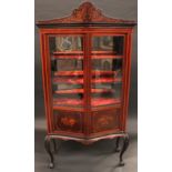 A large Edwardian mahogany and marquetry serpentine display cabinet, of 18th century design,