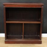 A late Victorian mahogany open bookcase, moulded rectangular top above an arrangement of shelves,