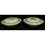 A pair of Clarice Cliff vegetable dishes and covers