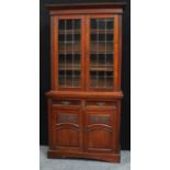 A Victorian walnut bookcase, cupboards to base, c.1890