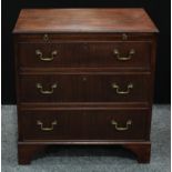A George III design mahogany bachelor?s chest, moulded top above a slide and three long graduated