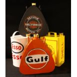 A reproduction Harley-Davidson Motor Oil can; others, Shell, Esso, Gulf (4)