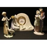 A Lladro 'Swan' clock, 5777, 18cm high; a Lladro model, Christmas Melodies, 6128; another, Girl with