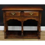 A George III style oak side table, oversailing moulded rectangular top above a pair of frieze
