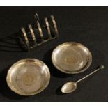 A silver toast rack, Birmingham 1913; a silver pin dish, marked Sterling, inset with Hong Kong one