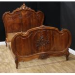 A contemporary hardwood bed, in the French Rococo taste, the headboard 157cm high, 158cm wide,