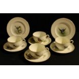 Two sets of Royal Worcester ornithological teacups, saucers, and tea plates, Swallow and Blue Tit,