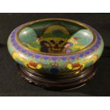 A Chinese cloisonne bowl decorated with dragons chasing flaming pearls, associated hardwood stand,