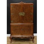 A Queen Anne style cocktail or drinks cabinet, retailed by H.Ponsford Ltd, 156cm high, 95cm wide,