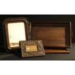 A carved hardwood rectangular photograph frame, glazed, 29cm x 24cm; a rounded rectangular wall