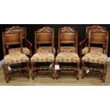 A set of eight 17th century style oak dining chairs, comprising six side chairs and a pair of