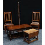 A pair of Arts & Crafts oak side chairs; an oak coffee table of 17th century design; a similar