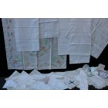 Textiles - an Irish linen white tablecloth decorated with shamrocks; others decorated with