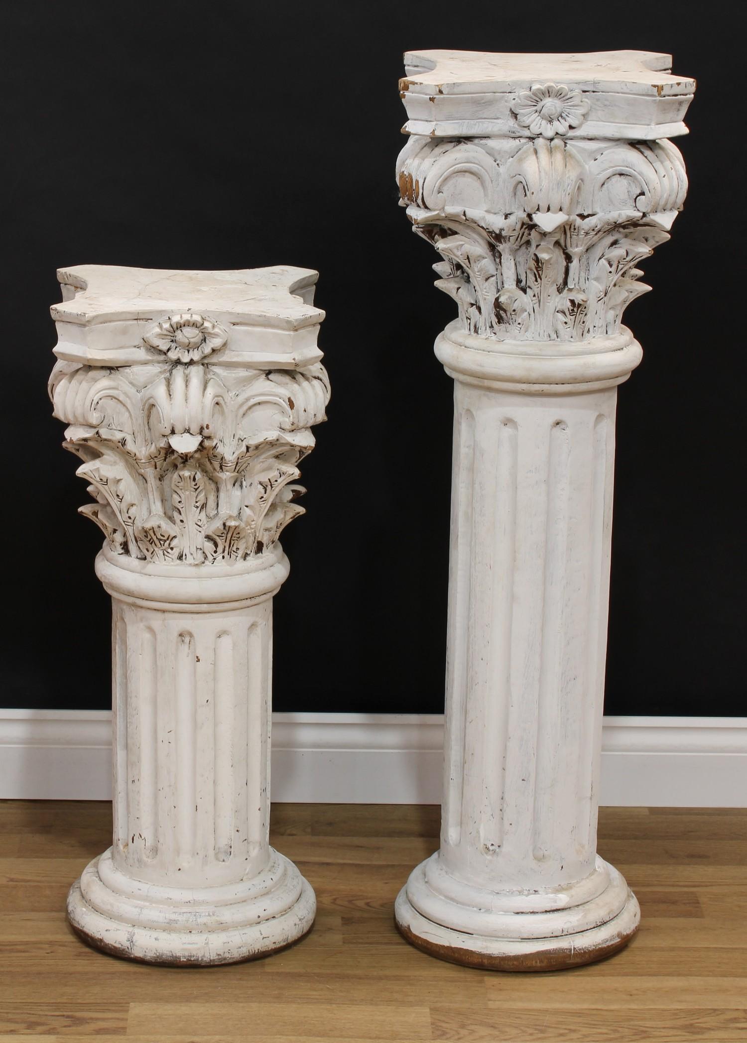 A pair of painted hardwood statuary pedestals, each as a Cornithian column with an incurve square