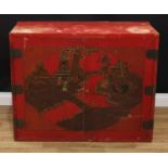 A Japanese red painted low side cabinet, in the 19th century lacquer taste, flush rectangular top