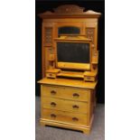 An Arts & Crafts two piece bedroom suite, comprising a single door wardrobe and dressing chest, each