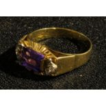 An 18ct diamond and amethyst ring, marked 750