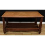 An Arts & Crafts oak refectory type 'trestle' dining table, rectangular top with moulded edge,