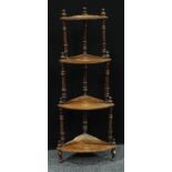 A Victorian mahogany four tier corner whatnot, graduated shelves, turned supports, 136cm high