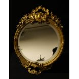 A Rococo style gilt metal wall mirror, bevelled plate, 49cm high