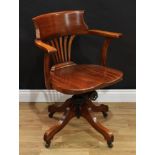 A Globe Wernicke mahogany swivel desk chair, quadform base, casters, 85cm high, 62cm wide, the