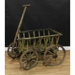 A country house estate garden/dog cart, spoked metal bound wheels, the carrying bed top 96cm x 69cm