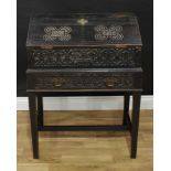 An oak 'bible' box on stand, carved throughout in the 17th century taste, fall front enclosing a