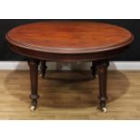 A Victorian mahogany circular dining table, moulded top, turned legs, ceramic casters, 71cm high,