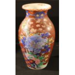 A large Japanese baluster vase, painted in underglaze blue with a large flowering peony, further