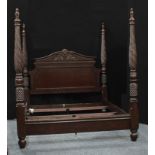 A reproduction mahogany four-poster double bed. 228cm high, 243.5cm long, 205cm wide.