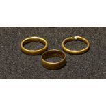 A 22ct gold wedding band; others; 11.2g (3)