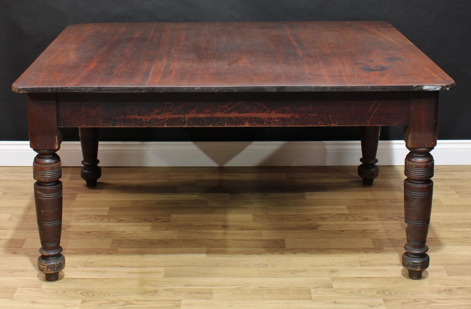 A 'late Victorian' mahogany dining table, rounded rectangular top, ring-turned legs, 72.5cm high,