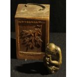 A Japanese bronze incense burner, as a monkey, 9cm high, in carved wooden box, Meiji period