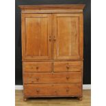 A 19th century pine housekeeper's cupboard or linen press, moulded cornice above a pair of panel