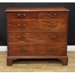 A George III mahogany chest, slightly oversailing rectangular top above two short and three long