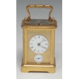 A late 19th century lacquered brass repeater carriage clock, 4cm circular enamel dial inscribed with