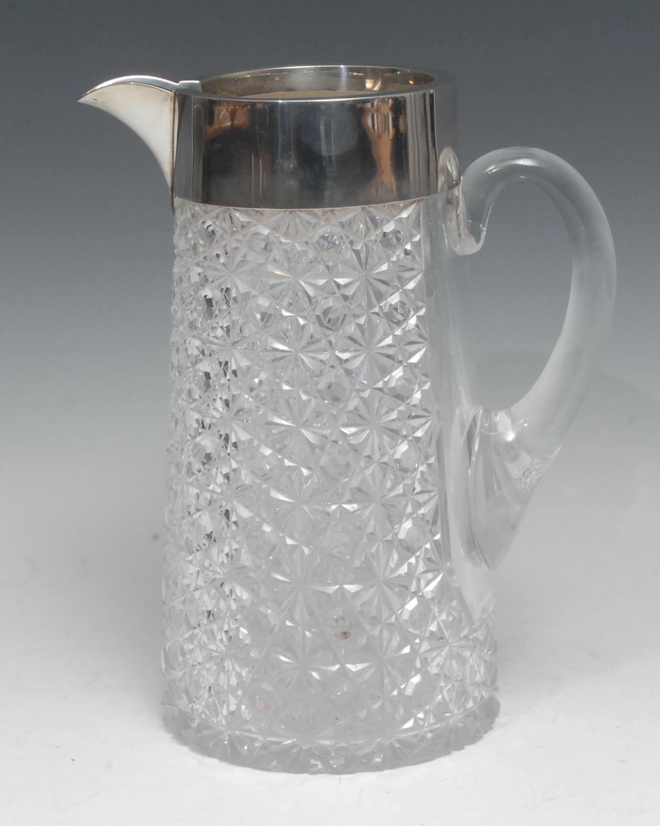 A substantial Victorian silver mounted hobnail-cut lemonade jug, scroll handle, star-cut base,