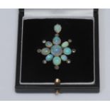 A late 19th century opal and diamond eight point pendant, composed of ten oval mixed sized opal