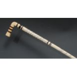 A 19th century whalebone, marine ivory and specimen hardwood walking stick, probably sailor's