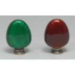 A pair of Scandinavian silver and enamel shell shaped peppers, decorated in tones of green and