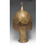 A Moorish Revival brass table lamp, pierced base and shade with beaded fringe, 61cm high