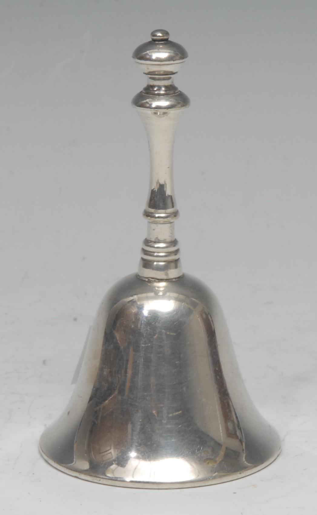 An early 20th century silver plated table bell, of 18th century design, 10.5cm high