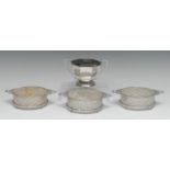 A set of three George V silver circular butter dishes, pierced borders, laurel wreath handles,