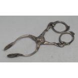 A pair of 18th century silver sugar tongs, shell nips, acanthus scroll frame, circular box pivot,