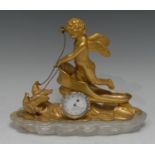 A Louis XV design gilt bonze and rock crystal manel time piece, the sculptural case cast as an