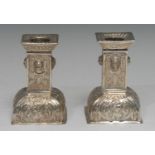 A pair of 19th century Continental silver square candlesticks, in the 18th century manner, chased